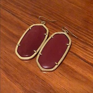 Maroon Kendra Scott earrings.